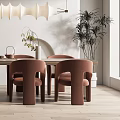 Modern Dining Table Set With Marble Top Brown Chairs Pendant Lights And Decorative Plants In Interior