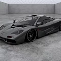 Gray Sports Car With Sleek Design And Black Wheels In Spacious Indoor Concrete Background