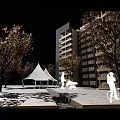 Community Outdoor Playground Area With High Rise Buildings Play Equipment Trees And Paved Ground