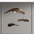 Three Modern Curved Bronze Pendant Lights With Metallic Finish For Interior Decor