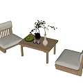 Elegant Wooden Tea Table And Chairs With Cushioned Seats Green Plant And Vase