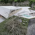 Modern Detached Villa With Sleek Roof Waterfront Reflection And Lush Lawn