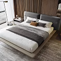 Contemporary Bedroom Interior Featuring Double Bed With Gray Upholstered Headboard White Sheets And Striped Blanket