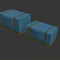 Two Blue Fabric Covered Boxes With Black Straps And Wooden Bases