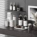 Modern Perfume Cosmetics Setup On Dark Counter With Shelves Candles Dried Plants And Wall Art