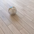 Wooden Stool With Soccer Ball Placed On Light Oak Hardwood Floor
