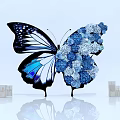 Artistic Butterfly Shaped Floral Installation With Blue White Flowers And Decorative Bottles