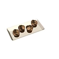 Four Chocolate Cupcakes With Cream Frosting And Chocolate Crumbs On White Rectangular Tray
