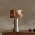 Minimalist Modern Table Lamp With Silver Metal Base And Marble Texture Shade On Wooden Table