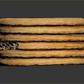 Stack of Golden Crackers with Small Holes on Surface on Dark Background