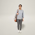 Woman In Striped Top Gray Pants And White Shoes With Striped Bag On Light Background