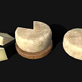 Whole Round Artisanal Cheese with Sliced Pieces on Wooden Board