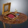 Open Golden Box With Red Cushion And Sun Shaped Ornament Decor Set On Round Tabletop