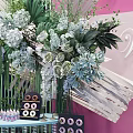 Elegant Wedding Tea Break Area With Floral Decorations Pink Backdrop And Decorative Table