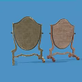 Pair Of Shield Shaped Stands With Gold And Brown Finish On Blue Background