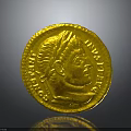 Ancient Gold Coin Featuring Detailed Portrait And Intricate Inscriptions On Surface