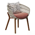 Modern Woven Outdoor Chair With Solid Wood Legs Comfortable Padded Seat And Leaf Print Pillow