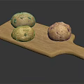 Three Nutty Bread Loaves Placed On Wooden Cutting Board