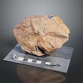 Natural Stone Specimen Placed On Mesh Pad With Blue Label And Measuring Ruler