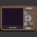 Nikon Electronic Digital Camera In Orange With LCD Screen And Control Buttons