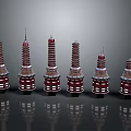 Six Red And White Layered Towers With Circular Base Spire And Reflections On Black Background