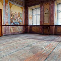 Elegant Historic Room Featuring Wooden Door Mural Paintings Windows Small Table And Wooden Floor