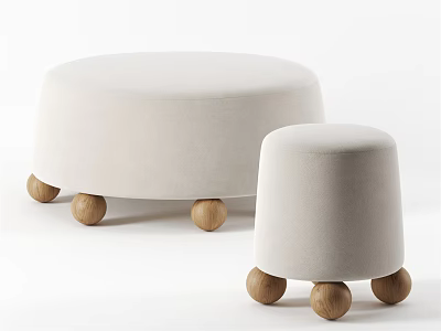 Two Light Colored Ottoman Stools With Wooden Ball Legs And Simple Design 3d model