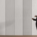 Sleek Modern Light Gray Textured Wall Panels Showcased In Interior Space By Man