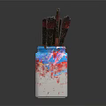 Paintbrushes in Colorful Vase With Blue Red White Paint Splatters On Dark Background