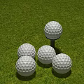 Sports Equipment Featuring Several Golf Balls On Tee And Green Grass Surface
