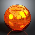 Orange Decorative Sphere with Grid Like Lines Circular Patterns and Glowing Interior Transparent Surface