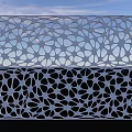Modern Garden Landscape Featuring Intricate White Perforated Panels And Blue Sky