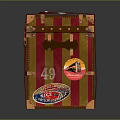 Vintage Trunk With Red And Gold Stripes And Various Travel Stickers