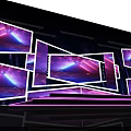 Commercial Equipment Stage Setup With Multiple Displays And Purple Blue Lighting