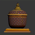 Decorative Container With Intricate Colorful Geometric Patterns And Gold Accents On Red Yellow Base