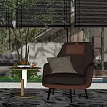 Elegant Black Leather Armchair With Gray Pillow And Small Round Table In Modern Interior