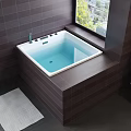 Modern Bathroom Interior With White Pedestal Washbasin Dark Tile Walls And Bathtub