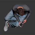 Man Sitting Using Smartphone Wearing Gray Sweater Light Blue Jeans White Shoes Against Gray Background