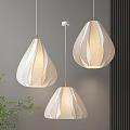 Three Modern Pleated White Pendant Lights With Soft Lighting In Interior Space 3d model