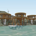 Circular Wooden Cabins on Waterfront Surrounded by Forest and Wind Turbine
