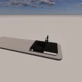 Black Kitchen Sink with Drainboard on White Countertop in Outdoor Grassy Setting