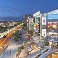 Vibrant Commercial Street Featuring Modern Buildings Billboards Pedestrians And Night Lights