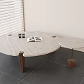 Round Coffee Table with Stone Top Wooden Legs Side Table Books Glasses in Modern Interior