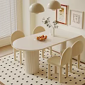 White Oval Desk With Chairs Fruit Vase Framed Pictures And Pendant Lights On Patterned Rug