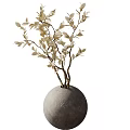 Round Gray Vase With Light Colored Leafy Branches As Decorative Flowers