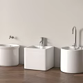 White Bathroom Washbasins Against Light Colored Wall With Faucets And Wooden Floor