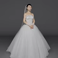 Beautiful Woman In White Strapless Wedding Dress With Veil And Lace Details
