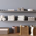 Woven and Lidded Storage Baskets on Wooden Floor with Grey Wall Shelves and Rolled Towels