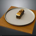 Layered Dessert On White Plate With Wooden Mat And Crunchy Topping