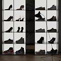 Modern Shoe Cabinet With Multiple Shelves Displaying Various Shoes And Black Lamp